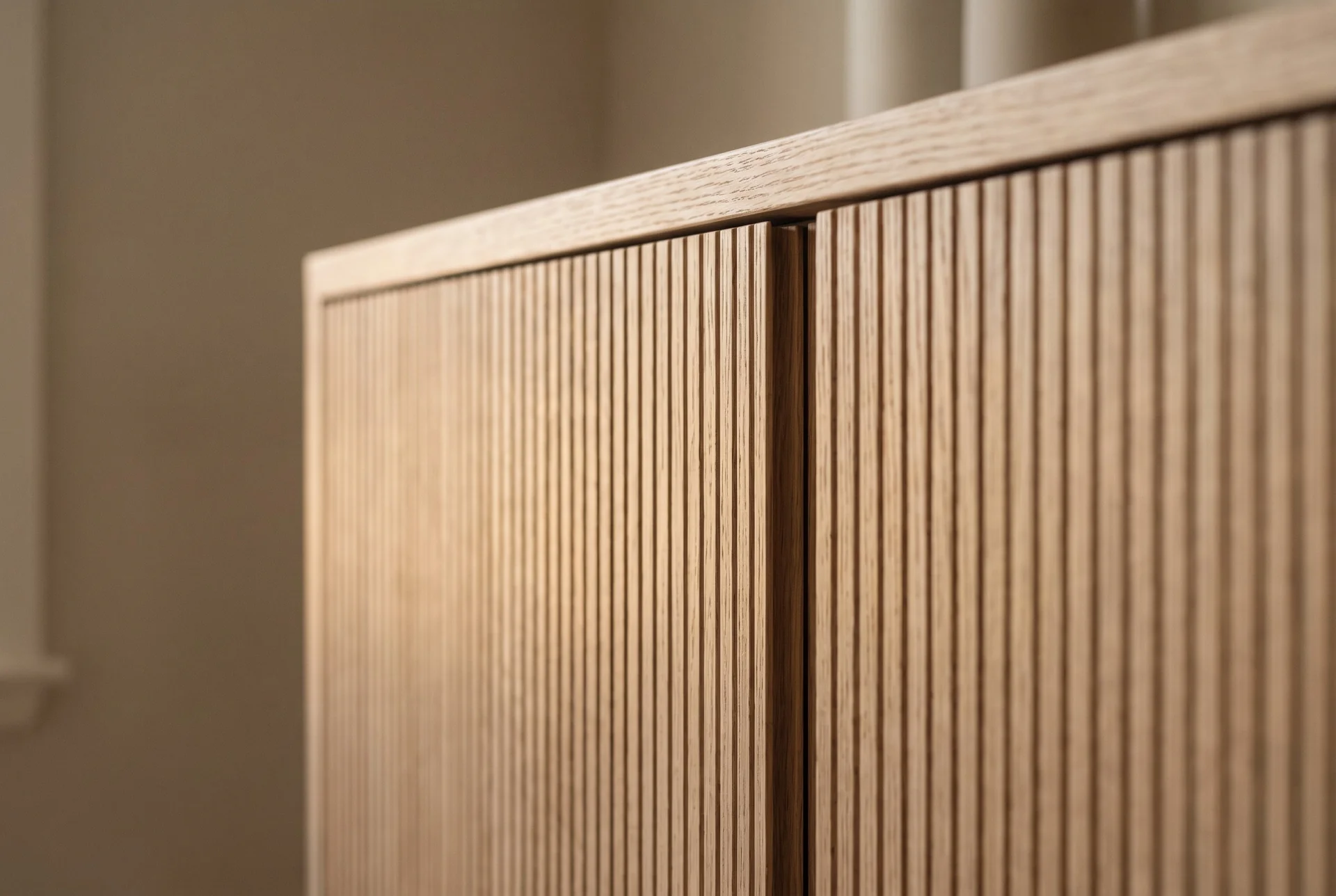 Custom cabinetry — shaker cabinets with brass hardware and lit glass fronts