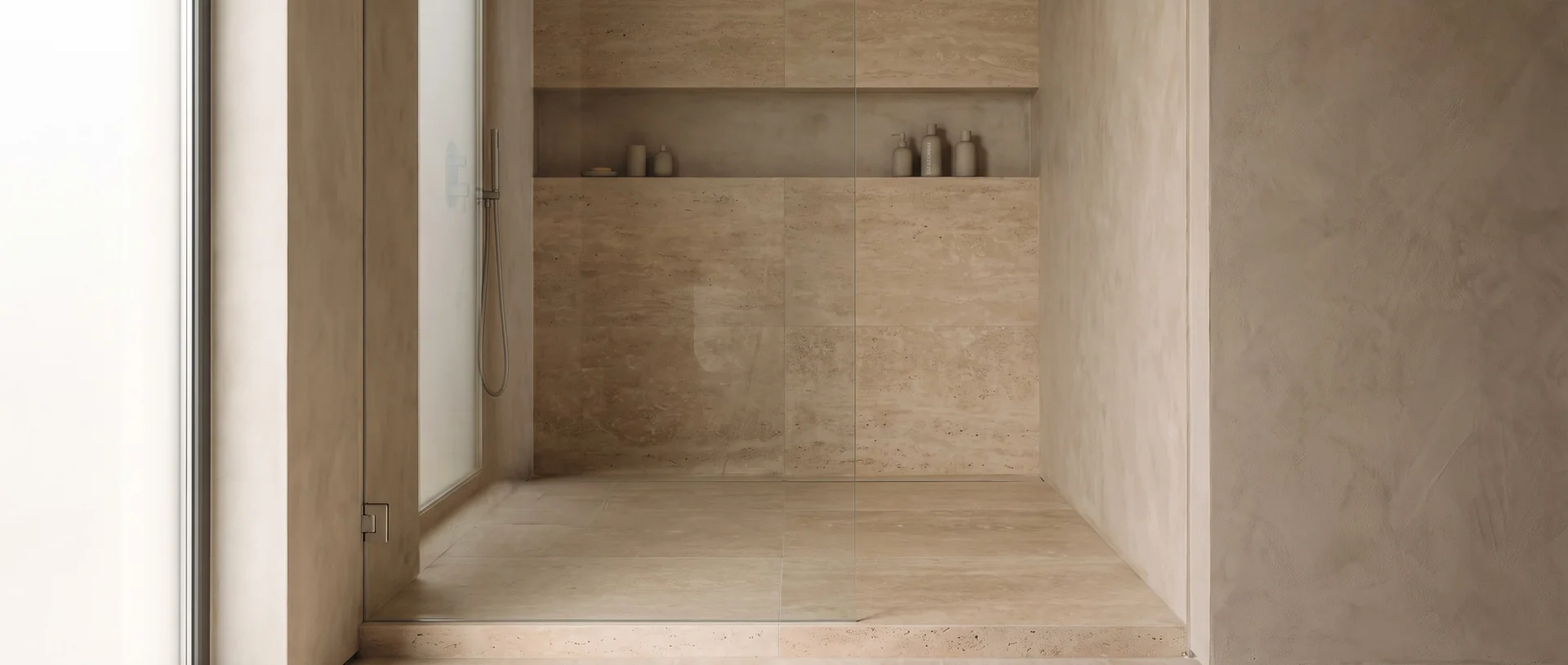 Walk-in shower — curbless travertine shower with brass rainfall head, Lehigh Valley PA